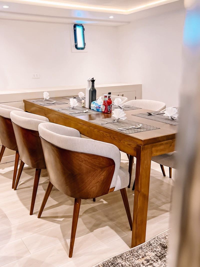 Dining table set for dinner on board