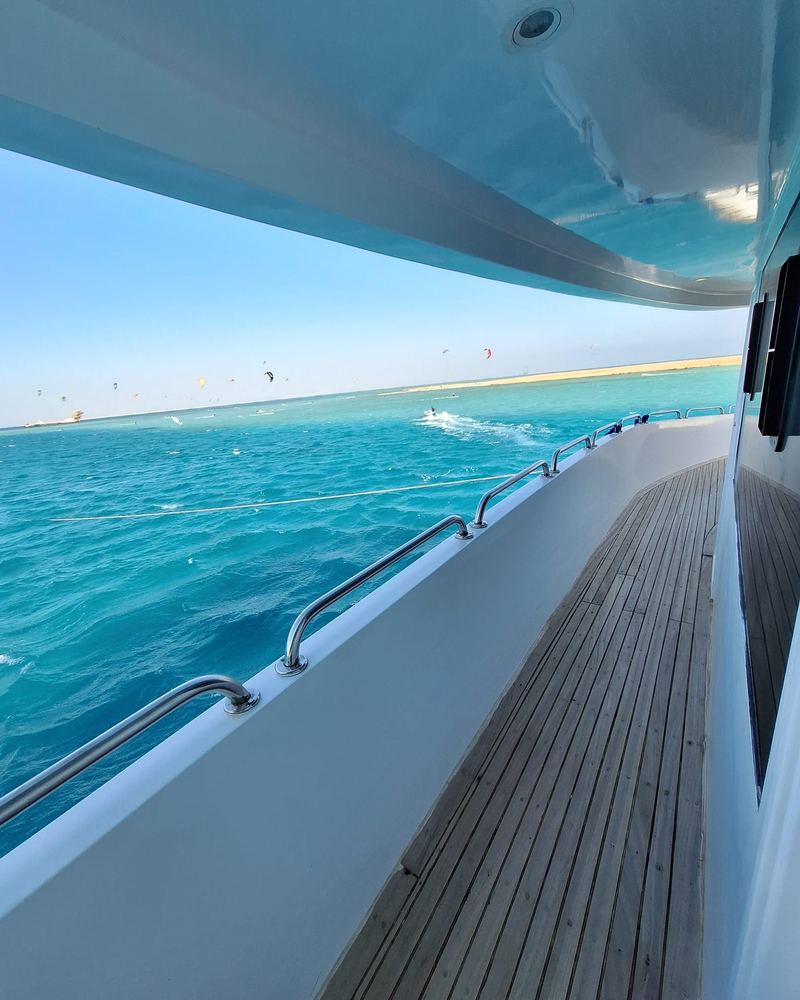Looking from the yacht deck at a lagoon full of kites