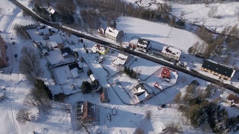 Snow-covered Moldava in the Czech Ore Mountains from a drone