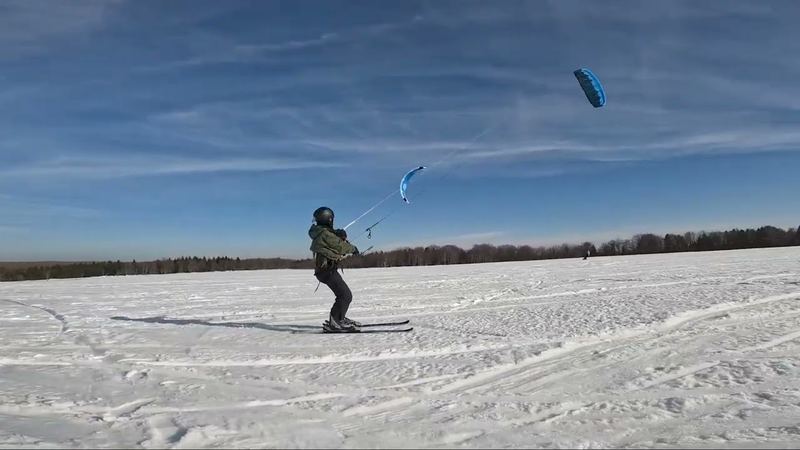 A snowkiter on skis on the snowy plateau at Moldava