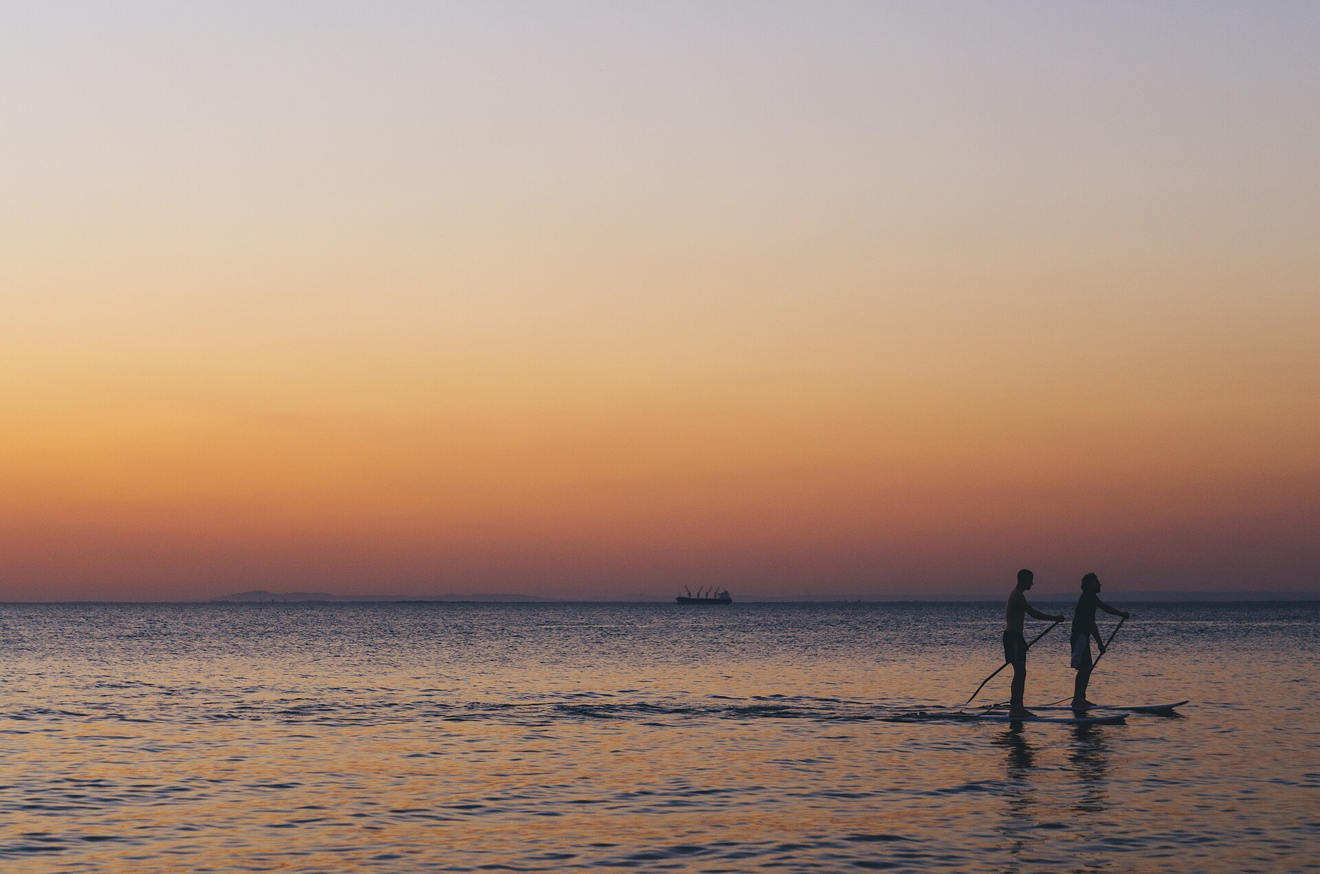 Sunset paddleboarding in Brighton (Unsplash)