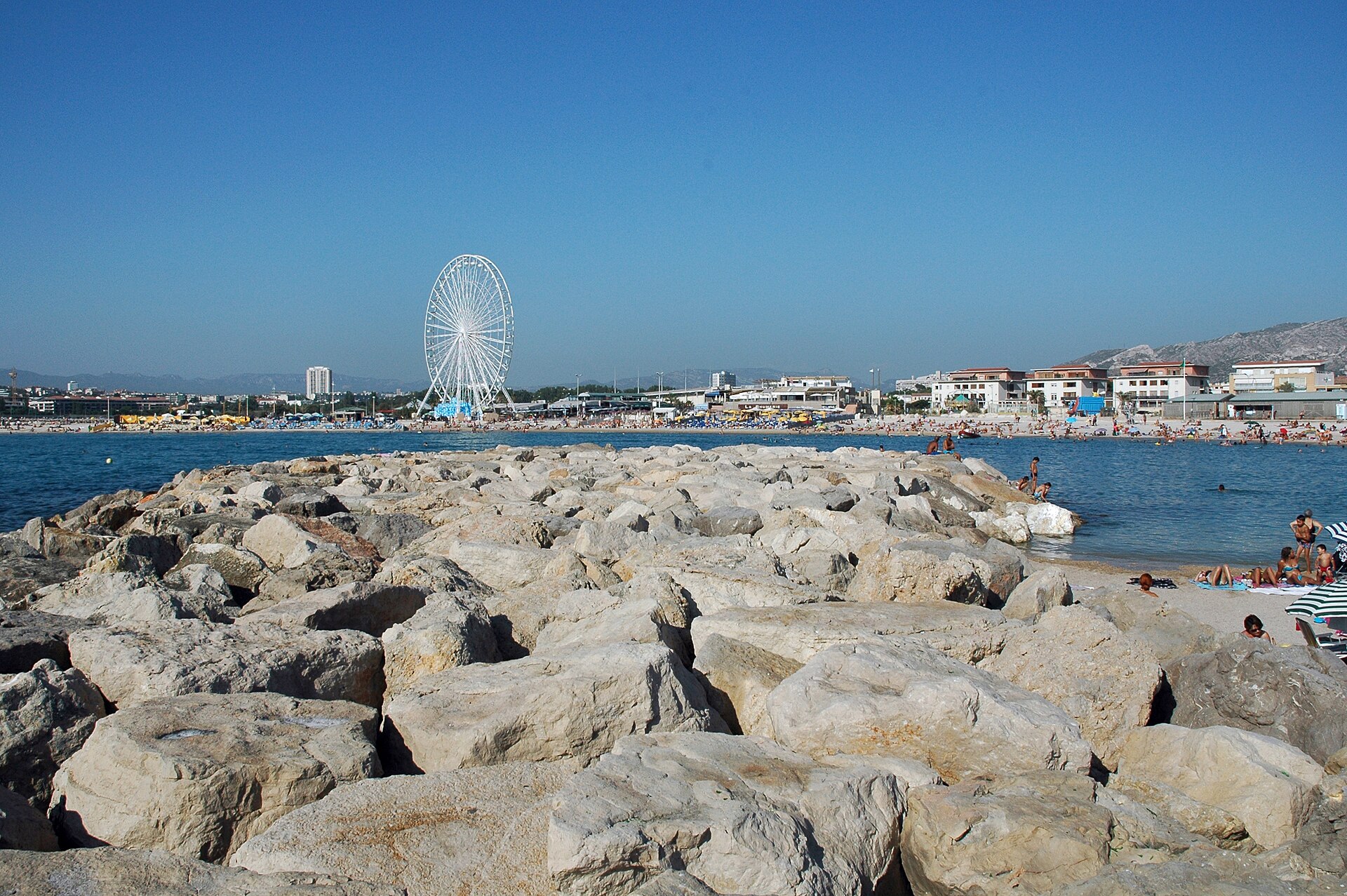 View of Plage de Bonneveine with ferris wheel from the breakwater, Marseille, 2012